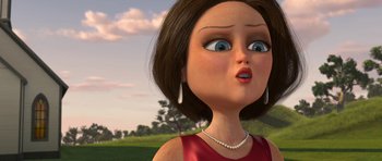 Movie still from “Monsters vs. Aliens” (2009), directed by Conrad Vernon – An animated woman in a red dress looks up at the sky; Close Up shot, Low angle