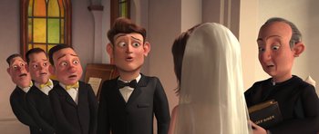 Movie still from “Monsters vs. Aliens” (2009), directed by Conrad Vernon – A man and a woman in wedding attire in front of a church; Close Up shot, Over the shoulder angle