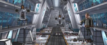 Movie still from “Monsters vs. Aliens” (2009), directed by Conrad Vernon – An airplane is flying in the sky over a train station; Extreme Wide shot, High angle