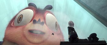 Movie still from “Monsters vs. Aliens” (2009), directed by Conrad Vernon – A woman looking at an animated creature on a screen; Extreme Close Up shot, Over the shoulder angle