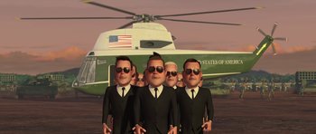 Movie still from “Monsters vs. Aliens” (2009), directed by Conrad Vernon – A group of men wearing suits and ties next to a helicopter; Wide shot, Low angle