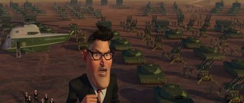 Movie still from “Monsters vs. Aliens” (2009), directed by Conrad Vernon – A cartoon of a man in a suit and tie; Extreme Wide shot, High angle