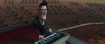 Movie still from “Monsters vs. Aliens” (2009), directed by Conrad Vernon – An animated man playing a keyboard in front of an open field; Medium shot, High angle
