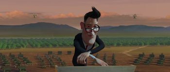 Movie still from “Monsters vs. Aliens” (2009), directed by Conrad Vernon – An animated man in a black suit is cutting a board; Medium shot, Over the shoulder angle