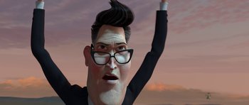Movie still from “Monsters vs. Aliens” (2009), directed by Conrad Vernon – An animated man wearing a suit and glasses; Close Up shot, Low angle