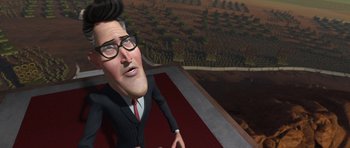 Movie still from “Monsters vs. Aliens” (2009), directed by Conrad Vernon – An animated man in a black suit and glasses; Close Up shot, Low angle
