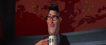 Movie still from “Monsters vs. Aliens” (2009), directed by Conrad Vernon – A man in a business suit is holding a coffee mug; Close Up shot, Low angle