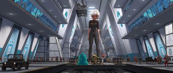 Movie still from “Monsters vs. Aliens” (2009), directed by Conrad Vernon – An animation of a woman standing on a train platform; Wide shot, Low angle