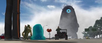 Movie still from “Monsters vs. Aliens” (2009), directed by Conrad Vernon – A car driving down a street next to a giant blue blob; Extreme Wide shot, Low angle