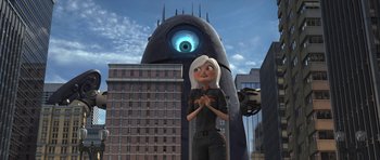 Movie still from “Monsters vs. Aliens” (2009), directed by Conrad Vernon – An animated woman standing in front of a giant monster; Wide shot, Low angle