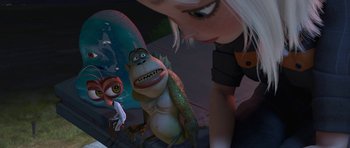 Movie still from “Monsters vs. Aliens” (2009), directed by Conrad Vernon – An animated scene of a woman looking at a monkey and a gorilla; Medium shot, High angle