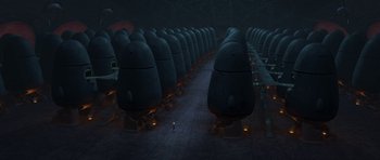 Movie still from “Monsters vs. Aliens” (2009), directed by Conrad Vernon – An image of a man standing in front of a bunch of tanks; Extreme Wide shot, High angle