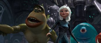 Movie still from “Monsters vs. Aliens” (2009), directed by Conrad Vernon – An animated character and a woman in a futuristic setting; Medium shot, Low angle