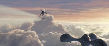 Movie still from “Monsters vs. Aliens” (2009), directed by Conrad Vernon – A man flying through the air while riding a skateboard on top of clouds; Extreme Wide shot, Low angle