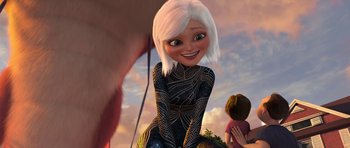 Movie still from “Monsters vs. Aliens” (2009), directed by Conrad Vernon – A woman with white hair sitting next to a man; Medium shot, Over the shoulder angle