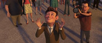 Movie still from “Monsters vs. Aliens” (2009), directed by Conrad Vernon – An animated man in a brown suit and a brown tie; Medium shot, High angle