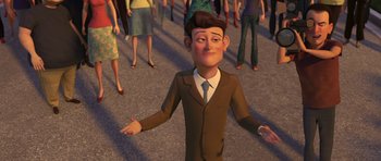 Movie still from “Monsters vs. Aliens” (2009), directed by Conrad Vernon – An animated man in a brown suit and a brown hat; Medium shot, High angle
