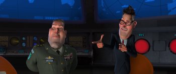 Movie still from “Monsters vs. Aliens” (2009), directed by Conrad Vernon – A cartoon of a man and a man in a military uniform pointing; Medium shot, Over the shoulder angle