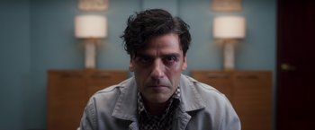 Movie still from “Moon Knight” (2022), directed by Mohamed Diab – A person wearing a shirt and jacket; Close Up shot, Over the shoulder angle