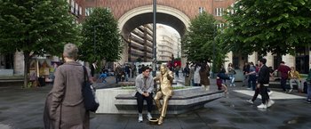 Movie still from “Moon Knight” (2022), directed by Mohamed Diab – A man sitting next to a statue of a person; Extreme Wide shot, High angle