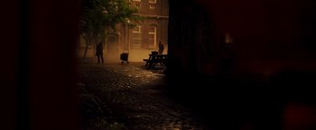 Movie still from “Moon Knight” (2022), directed by Mohamed Diab – A person walking down a street at night; Extreme Wide shot, High angle