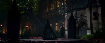 Movie still from “Moon Knight” (2022), directed by Mohamed Diab – A man standing on a stage in front of a building; Extreme Wide shot, High angle