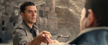 Movie still from “Moon Knight” (2022), directed by Mohamed Diab – A person holding something in his hand; Close Up shot, Over the shoulder angle