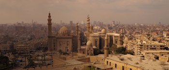 Movie still from “Moon Knight” (2022), directed by Mohamed Diab – An aerial view of a city with many buildings; Extreme Wide shot, High angle