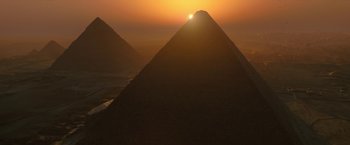 Movie still from “Moon Knight” (2022), directed by Mohamed Diab – The sun is setting over the great pyramids of gizeh; Extreme Wide shot, Low angle