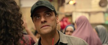 Movie still from “Moon Knight” (2022), directed by Mohamed Diab – A person wearing a hat; Close Up shot, Over the shoulder angle