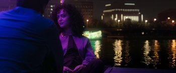 Movie still from “Moon Knight” (2022), directed by Mohamed Diab – A woman sitting on a boat at night; Medium shot, Over the shoulder angle