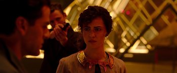 Movie still from “Moon Knight” (2022), directed by Mohamed Diab – A woman in a brown dress and a man taking a picture of her face; Close Up shot, Over the shoulder angle