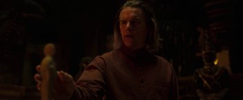 Movie still from “Moon Knight” (2022), directed by Mohamed Diab – A man with long blonde hair wearing a brown jacket; Close Up shot, Over the shoulder angle