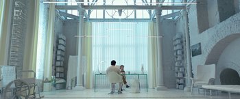 Movie still from “Moon Knight” (2022), directed by Mohamed Diab – Two people sitting at a glass table in front of a window; Wide shot, Low angle