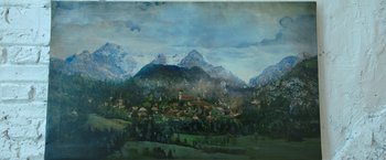 Movie still from “Moon Knight” (2022), directed by Mohamed Diab – An oil painting of a town in the middle of mountains; Extreme Wide shot, Low angle