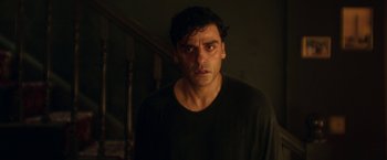 Movie still from “Moon Knight” (2022), directed by Mohamed Diab – A person wearing a black t - shirt; Close Up shot, Over the shoulder angle