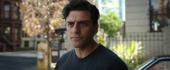 Movie still from “Moon Knight” (2022), directed by Mohamed Diab – A person wearing a black t - shirt; Close Up shot, Over the shoulder angle