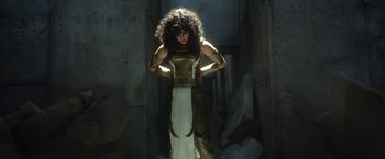 Movie still from “Moon Knight” (2022), directed by Mohamed Diab – A woman dressed in egyptian costume posing for a picture; Medium shot, Low angle