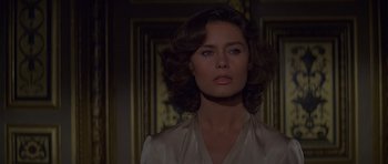 Movie still from “Moonraker” (1979), directed by Lewis Gilbert – A beautiful woman in a white shirt looking at the camera; Close Up shot, Over the shoulder angle