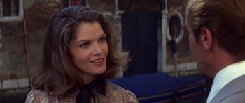 Movie still from “Moonraker” (1979), directed by Lewis Gilbert – A person wearing a dress; Close Up shot, Over the shoulder angle