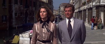 Movie still from “Moonraker” (1979), directed by Lewis Gilbert – A man and a woman walking down a street; Medium shot, Low angle