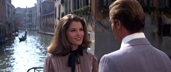 Movie still from “Moonraker” (1979), directed by Lewis Gilbert – A man and a woman talking on the street; Close Up shot, Over the shoulder angle