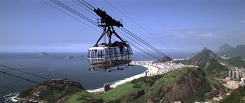 Movie still from “Moonraker” (1979), directed by Lewis Gilbert – A cable car going over the top of a hill; Extreme Wide shot, Low angle
