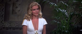 Movie still from “Moonraker” (1979), directed by Lewis Gilbert – A beautiful blonde woman in a white dress; Close Up shot, Over the shoulder angle