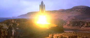 Movie still from “Moonraker” (1979), directed by Lewis Gilbert – A rocket taking off into the sky at sunset; Extreme Wide shot, Low angle