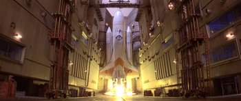 Movie still from “Moonraker” (1979), directed by Lewis Gilbert – A space shuttle in a hangar with a light beam coming from it; Extreme Wide shot, Low angle