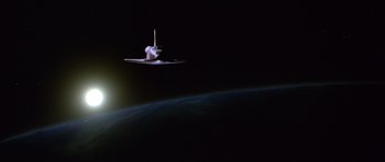 Movie still from “Moonraker” (1979), directed by Lewis Gilbert – An image of a space shuttle in the sky; Extreme Wide shot, Low angle