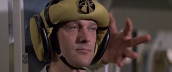 Movie still from “Moonraker” (1979), directed by Lewis Gilbert – A person wearing a helmet; Close Up shot, Low angle