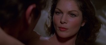 Movie still from “Moonraker” (1979), directed by Lewis Gilbert – A woman looking at the camera; Close Up shot, Over the shoulder angle