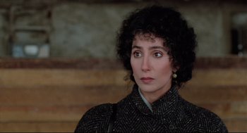 Movie still from “Moonstruck” (1987), directed by Norman Jewison – A person wearing a jacket; Close Up shot, Over the shoulder angle